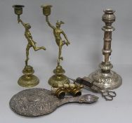 A pair of brass figural candlesticks, opera glasses, plated candlesticks and snuffers and a silver