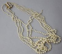 A five strand graduated cultured pearl necklace with 9ct gold, ruby and cultured pearl set clasp, (