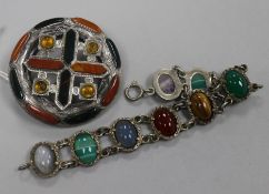An early 20th century Scottish white metal and hardstone brooch and a Scottish white metal and multi