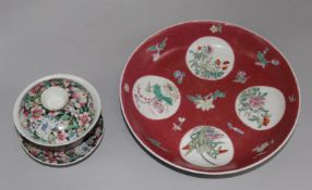 A Chinese ruby ground famille rose dish, early 20th century and a rice bowl, cover and stand