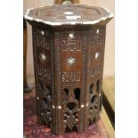 An Islamic bone inlaid wood octagonal table, H.47cm