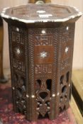 An Islamic bone inlaid wood octagonal table, H.47cm