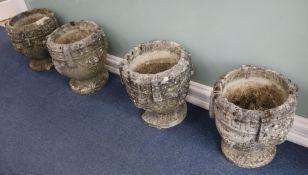 Four stone urns H.40cm