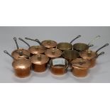 Twelve miniature copper saucepans for individual sauce vessels or brandy warmers