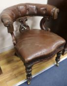 A Victorian leather library chair