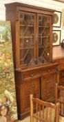An Edwardian oak bookcase cabinet, H.122cm
