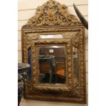 A brass framed wall mirror, H.95cm