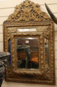 A brass framed wall mirror, H.95cm