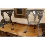 A set of four cast iron base circular pub tables, H.67cm