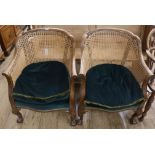 A pair of Bergere tub chairs