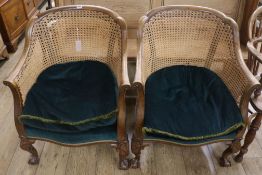 A pair of Bergere tub chairs