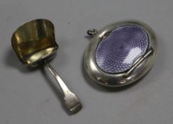 A George V silver and lavender enamel powder compact and a George III silver 'scuttle' caddy spoon,