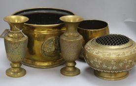 A collection of Indian and other brassware, including a jardiniere, applied with masks and a roundel