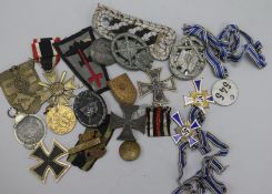Three German 'Mutterehrenkreuz', a 'Winterschlact Im Osten' medal, Third Reich Merit Cross, Black