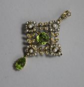 An Edwardian gold, peridot and seed pearl pendant brooch, stamped 15ct. 5.2cm drop