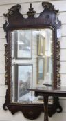 A George II red walnut and gilt wall mirror, H.95cm