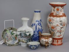 A collection of Asian ceramics, including a Chinese white ground flattened pyriform vase, a Japanese