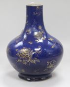 A Chinese Kangxi style dark powder blue ground vase, with gilt decoration of flowers and fruit, with