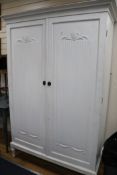 A white painted two door wardrobe, H.195cm