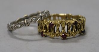 A contemporary gold and ruby set ring and a white gold and stone set eternity ring, both stamped