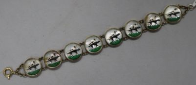 A gilt metal and reverse intaglio 'dog' bracelet, length 20cm