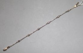 A gold and diamond articulated line bracelet, stamped 'Favori 585', length 18.5cm