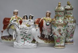 A pair of Staffordshire groups, cowhand and milkmaid with cows, a Parson and Nightwatchman group and