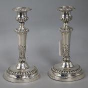 A pair of George III silver candlesticks, by Matthew Boulton, Birmingham 1808, loaded bases, h. 19.