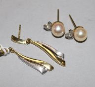 A pair of 18ct white and yellow gold and diamond 'tassel' earrings and a pair of 18ct gold pearl and