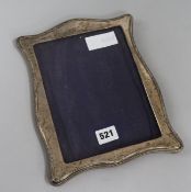 A George V silver photograph frame, Boots PDC, Birmingham 1921, oak easel back, 26cm