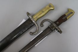 Two French bayonets; a M1866 pattern Yataghan sword bayonet, the blade etched ... d'Oumes de St.