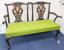 A George III Chippendale style mahogany double chair back sofa, c.1760, some later elements, W.