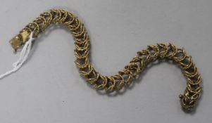 A 9ct gold plain and twist multi-link chain bracelet, 23.4gr