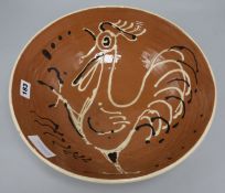 A 1950's cockerel decorated pottery bowl