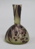 A Galle bottle-shaped cameo glass vase decorated with berries and leaves