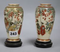 A pair of Japanese vases on stands