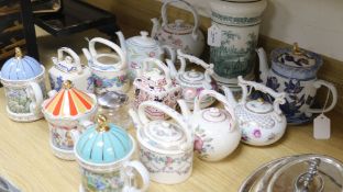 Thirteen collector's ceramic teapots, including examples by Sadler, Wedgwood, Coalport, etc., a