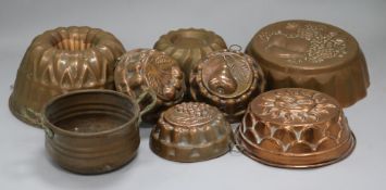 A group of copper jelly moulds