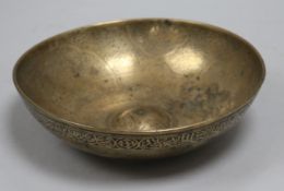 An Islamic bronze magic bowl with incised Koranic inscriptions within geometric motifs, Dia 7.5in (