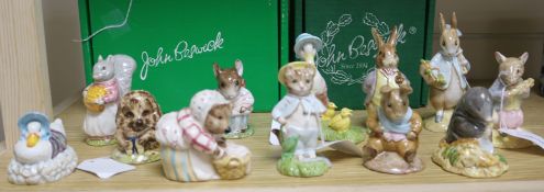 A collection of fourteen Beswick Beatrix Potter figures, including 'Hunca Munca Pan' (Style Two) and