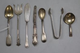 Seven items of silver cutlery, including a George III beaded caddy spoon, Thomas Wallis II, London