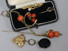 A 9ct gold bar brooch and four other items including a coral pin and locket