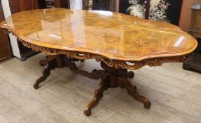 A serpentine dining table, W.245cm