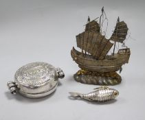 A Tibetan embossed white metal circular gau box and two other items, including a Chinese white metal