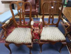 A pair of Queen Anne style walnut elbow chairs