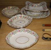 An early 19th century Derby matched part dinner service, decorated with rose garlands, sprigs and