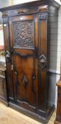 A 1920's oak hall cupboard, H.200cm