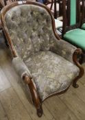 A Victorian button back elbow chair