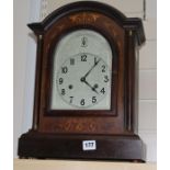 A mahogany and marquetry mantel clock