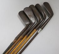 J. Brown Mashie, another two putters and a mid iron, Hickory shafted